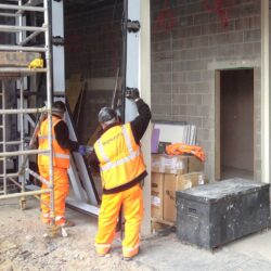 technical support Installations men installing steel framework